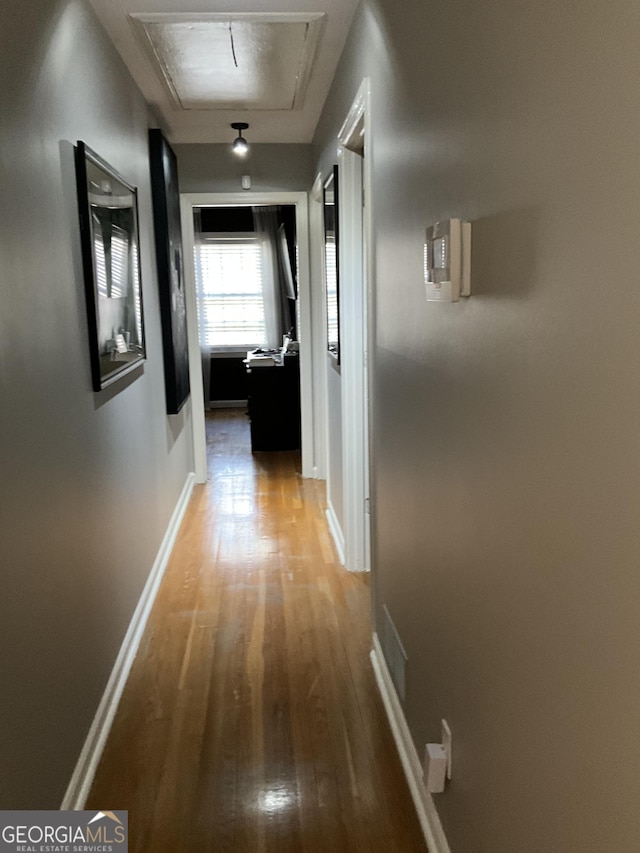 corridor with light hardwood / wood-style flooring