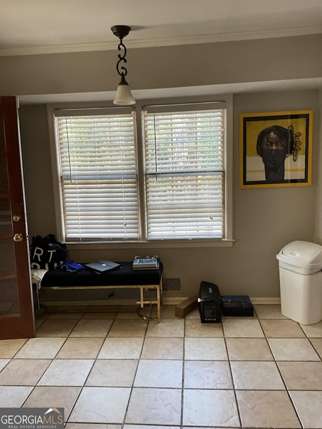 bathroom with light tile patterned floors and ornamental molding