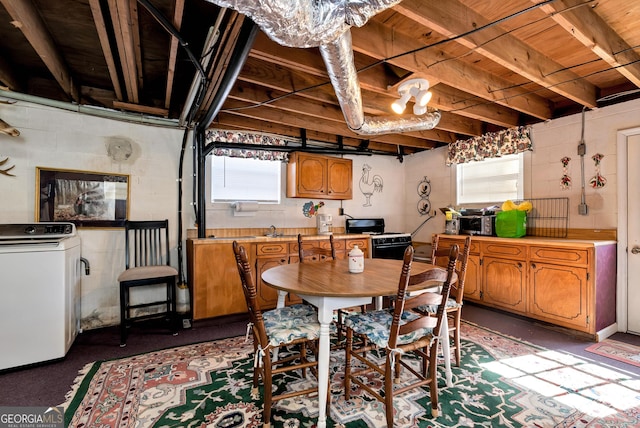 dining space with washer / dryer and sink