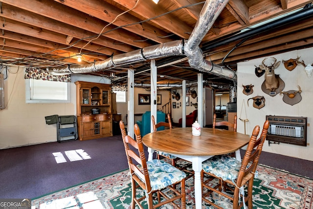 dining area featuring carpet floors and heating unit