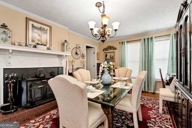 dining room featuring an inviting chandelier, crown molding, a textured ceiling, a wood stove, and dark hardwood / wood-style floors