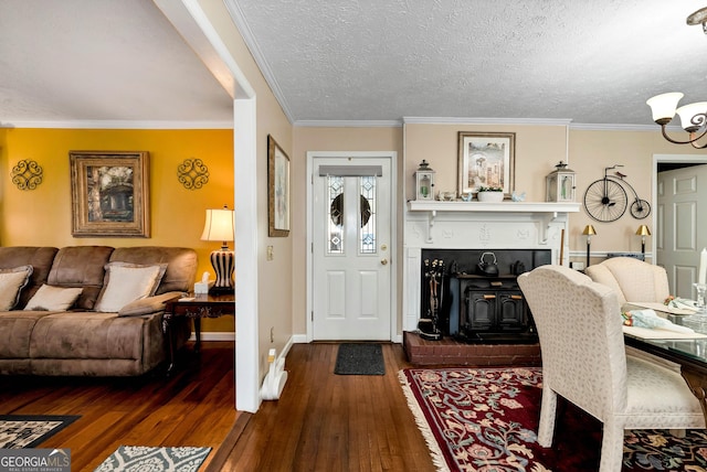 interior space with crown molding, a wood stove, a textured ceiling, and dark hardwood / wood-style flooring