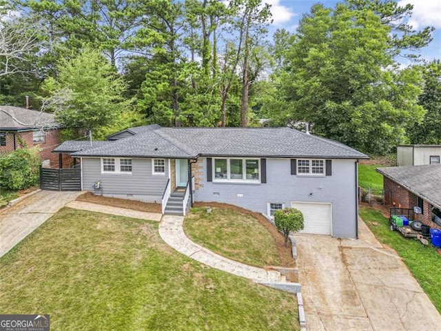 view of front of home featuring a garage, a front yard, crawl space, and driveway