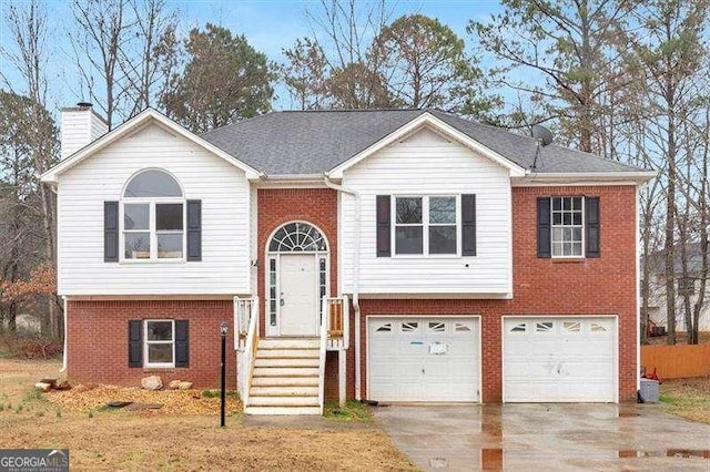 bi-level home featuring a garage