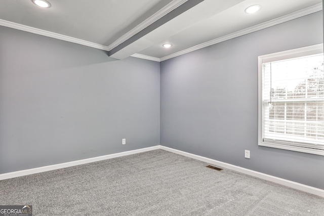 unfurnished room with carpet and crown molding