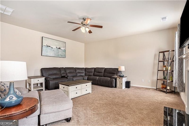 carpeted living room featuring ceiling fan