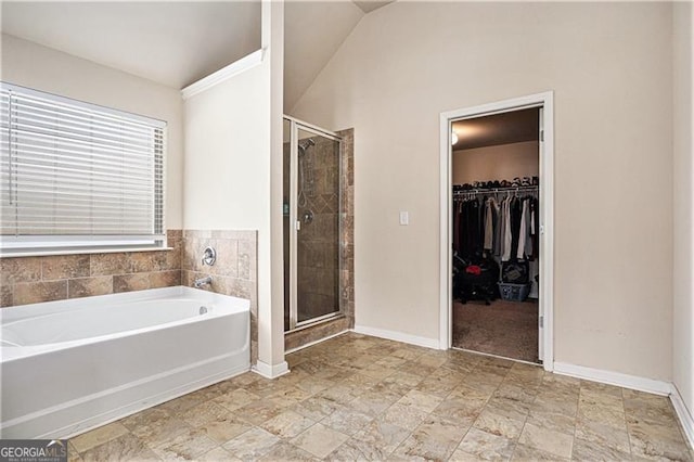 bathroom featuring independent shower and bath