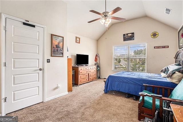 bedroom with ceiling fan, lofted ceiling, and carpet floors