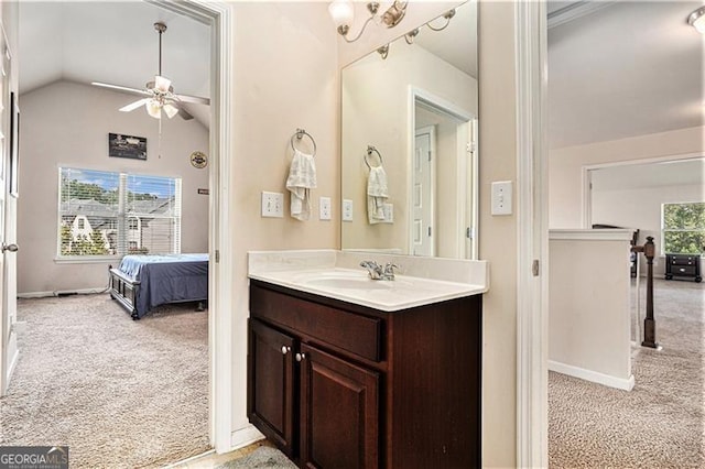 bathroom with vanity, lofted ceiling, and ceiling fan