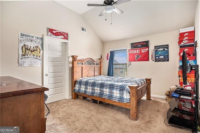 carpeted bedroom featuring vaulted ceiling and ceiling fan