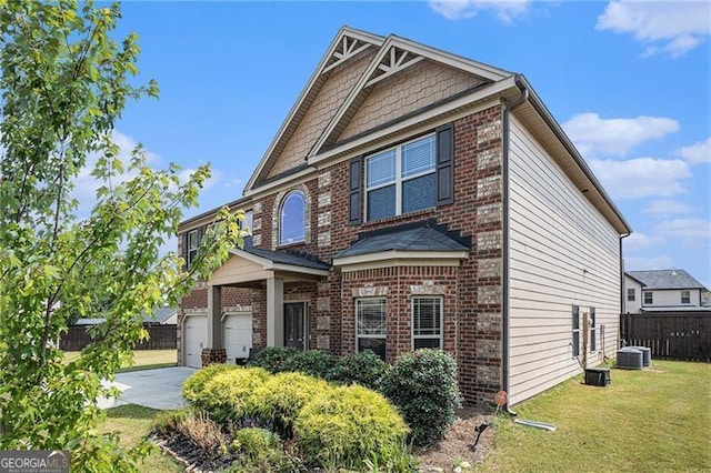 view of front of house with a garage and a front lawn