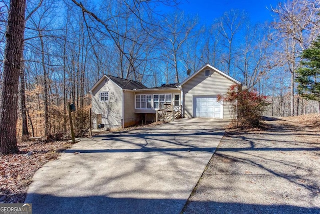 view of front of property with driveway and an attached garage