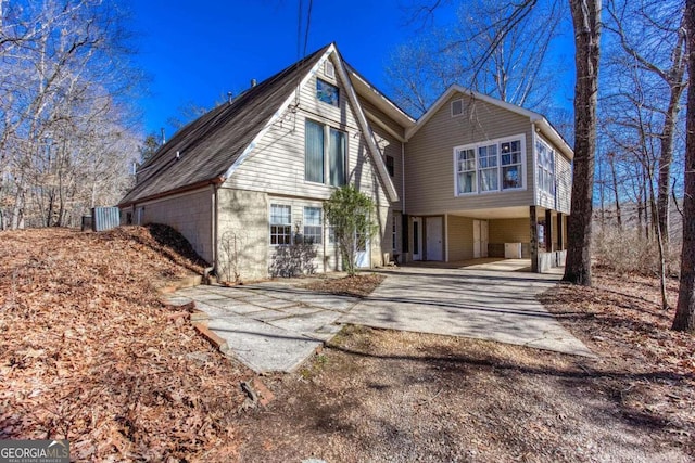 exterior space featuring driveway and a carport