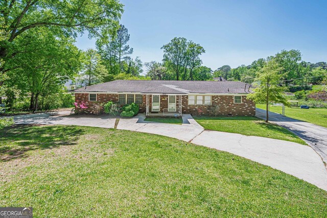 3710 Lynn Dr, Powder Springs, GA 30127 - ranch-style house with brick siding and a front yard