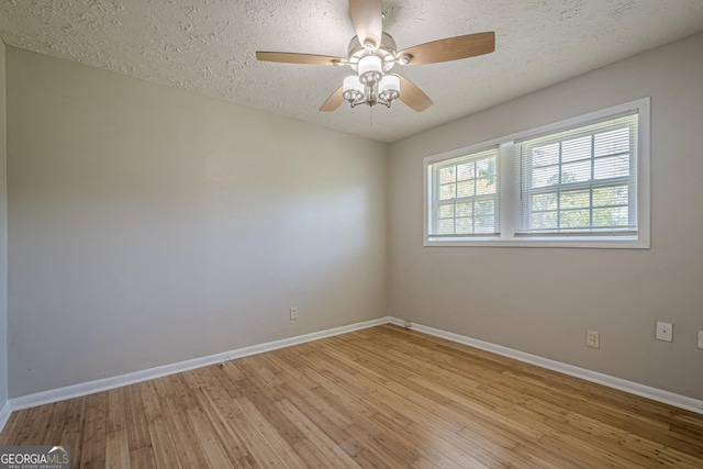 3710 Lynn Dr, Powder Springs, GA 30127 - unfurnished room featuring ceiling fan, baseboards, a textured ceiling, and light wood finished floors