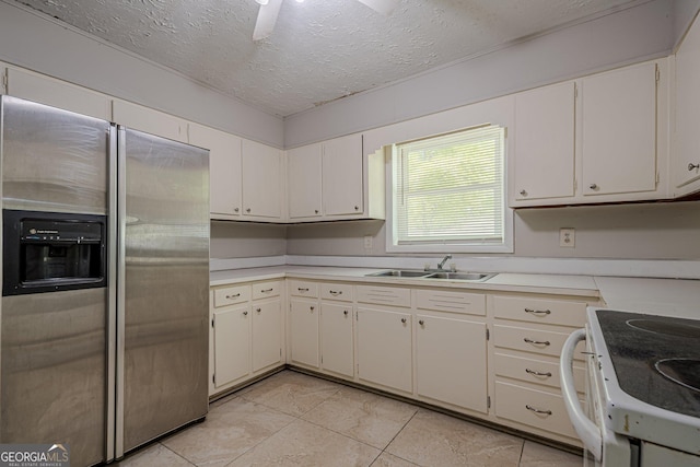 3710 Lynn Dr, Powder Springs, GA 30127 - kitchen with white electric range oven, a sink, a textured ceiling, stainless steel refrigerator with ice dispenser, and light countertops