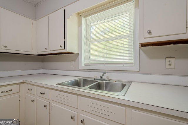 3710 Lynn Dr, Powder Springs, GA 30127 - kitchen with light countertops, a sink, and white cabinetry