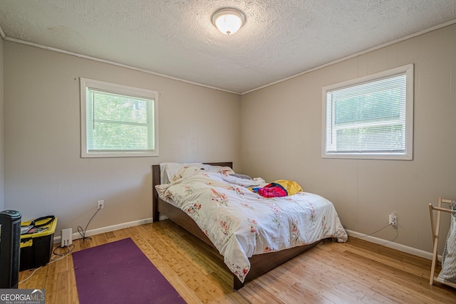 3710 Lynn Dr, Powder Springs, GA 30127 - bedroom with light wood-type flooring, ornamental molding, and multiple windows