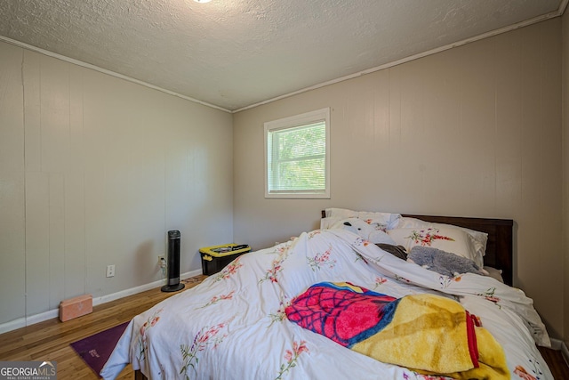 3710 Lynn Dr, Powder Springs, GA 30127 - bedroom with wood finished floors, a textured ceiling, baseboards, and ornamental molding