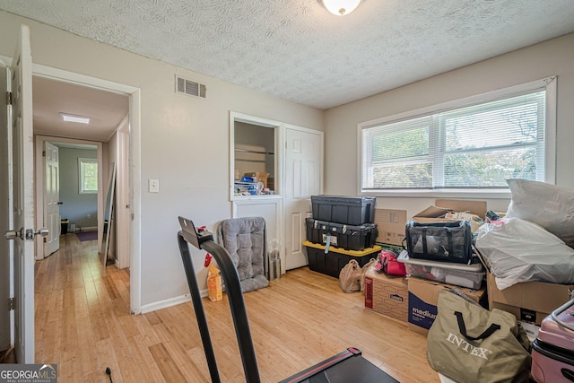 3710 Lynn Dr, Powder Springs, GA 30127 - interior space featuring baseboards, visible vents, a textured ceiling, and light wood-style floors