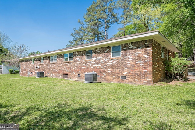 3710 Lynn Dr, Powder Springs, GA 30127 - view of side of property featuring brick siding, a yard, and cooling unit