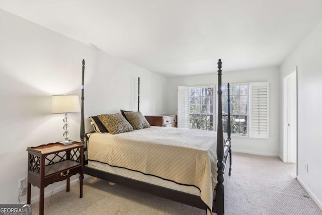 bedroom featuring light carpet