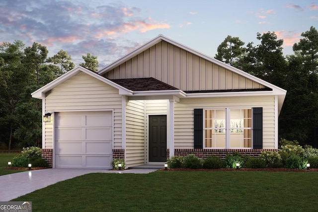 view of front of house with a garage and a lawn