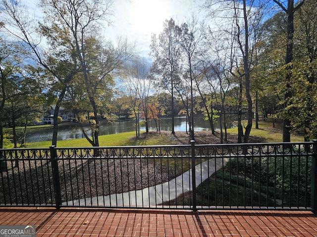 view of gate with a water view