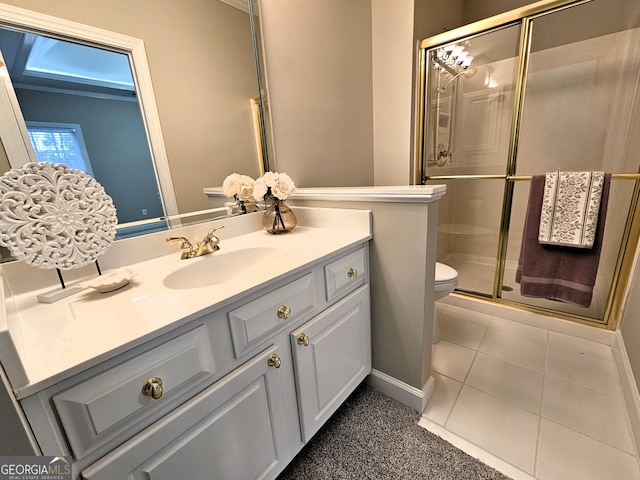 bathroom with vanity, toilet, tile patterned floors, and walk in shower