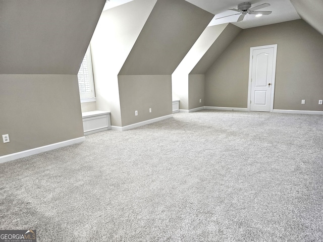 bonus room with vaulted ceiling, ceiling fan, and carpet