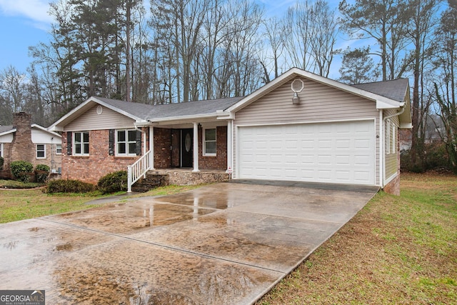 single story home featuring a garage and a front lawn