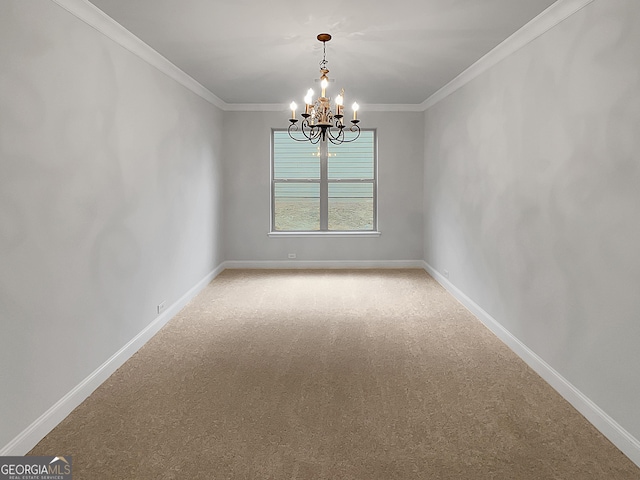 carpeted spare room featuring ornamental molding and a notable chandelier