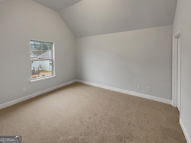 bonus room featuring lofted ceiling and carpet