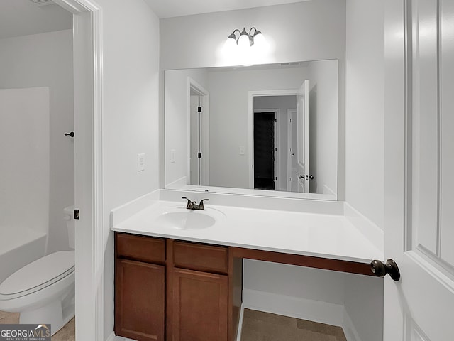 bathroom featuring vanity and toilet