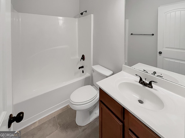 full bathroom with washtub / shower combination, vanity, toilet, and tile patterned floors