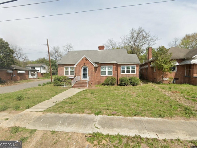 view of front of home with a front yard