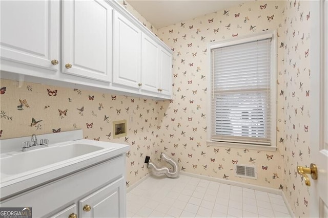 laundry room with washer hookup, sink, and cabinets