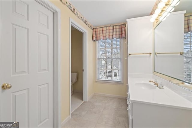 bathroom with vanity and toilet