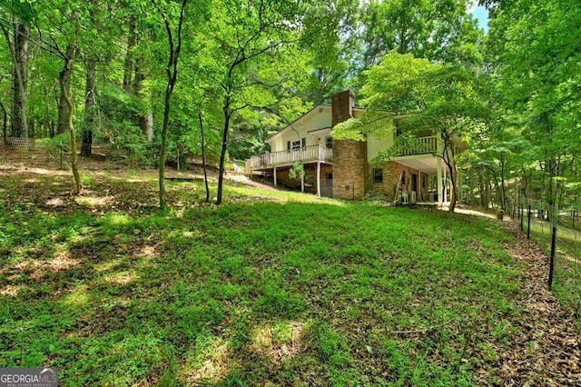 view of yard with a wooden deck