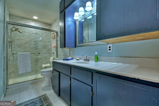 bathroom with tile patterned floors, toilet, an enclosed shower, a textured ceiling, and vanity