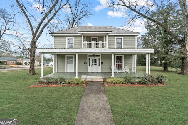 view of front facade featuring covered porch and a front lawn