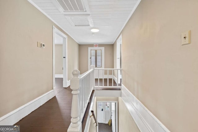 hall featuring crown molding and dark hardwood / wood-style floors