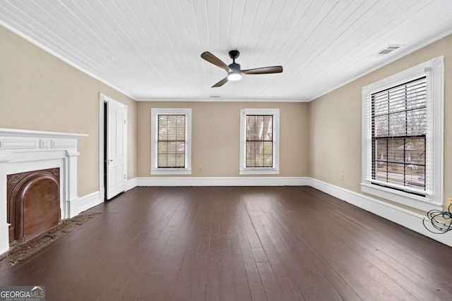 unfurnished living room with wood ceiling, dark wood-type flooring, ornamental molding, and ceiling fan