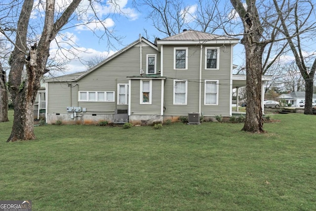 view of front of property with a front yard and central air condition unit