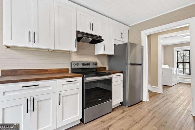 kitchen featuring butcher block counters, white cabinetry, stainless steel appliances, washer / clothes dryer, and light wood-type flooring