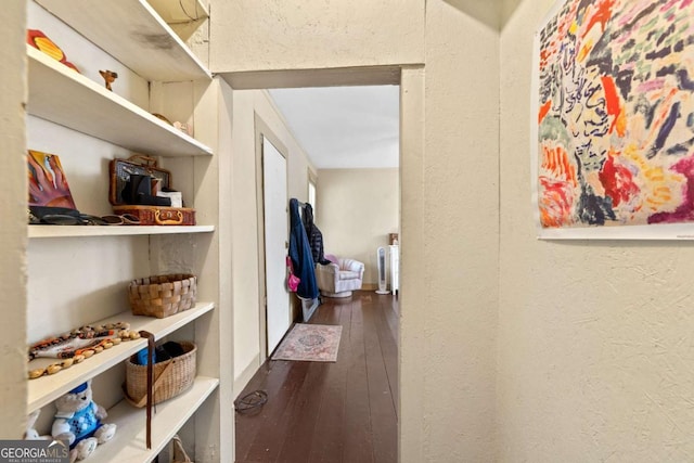 corridor featuring dark hardwood / wood-style flooring