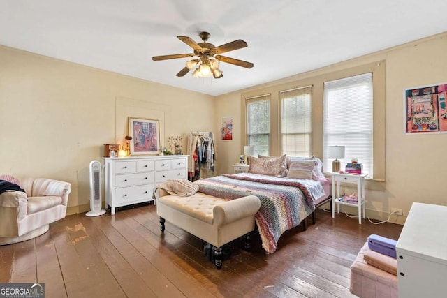 bedroom featuring ceiling fan and dark hardwood / wood-style floors