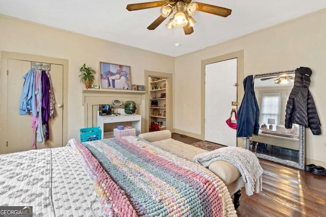 bedroom with wood-type flooring, a closet, and ceiling fan