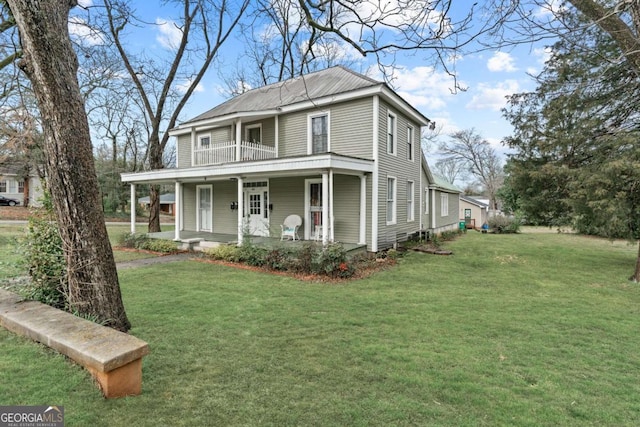 view of front of home featuring a front yard, a balcony, and a porch