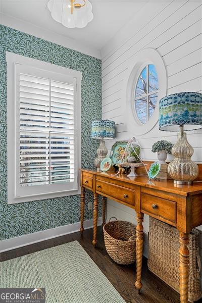122 Brighton Blvd, Woodstock, GA 30188 - home office featuring baseboards, wallpapered walls, and wood finished floors